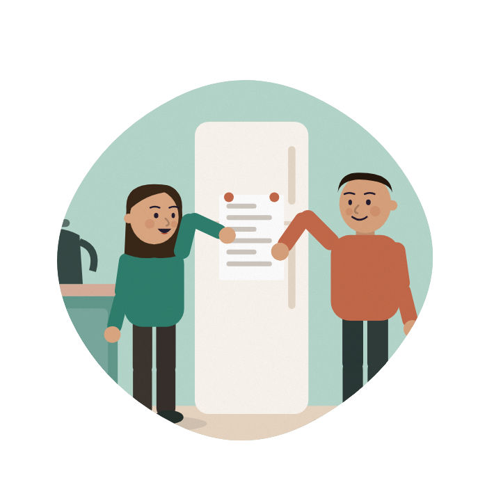 A family gathers round a fridge, pointing at a plan stuck to the door.